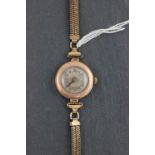 A ladies 9ct rosegold 15 jewel Rolex wristwatch with plated strap