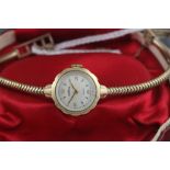 A ladies Roamer 9ct yellow gold wristwatch and strap