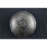 A Georg Jensen sterling silver pill box and cover; with applied raised floral motif; incised Georg