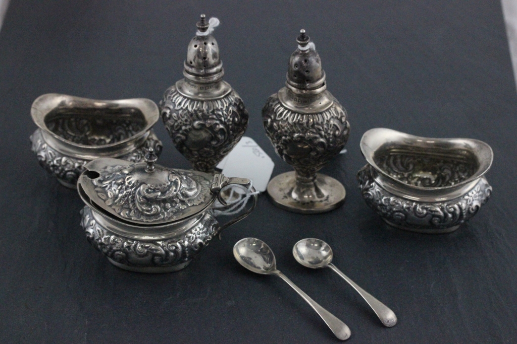 A matched Edwardian hallmarked silver cruet set; Joseph Gloster Ltd; Birmingham 1910 - 1911;