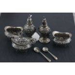 A matched Edwardian hallmarked silver cruet set; Joseph Gloster Ltd; Birmingham 1910 - 1911;