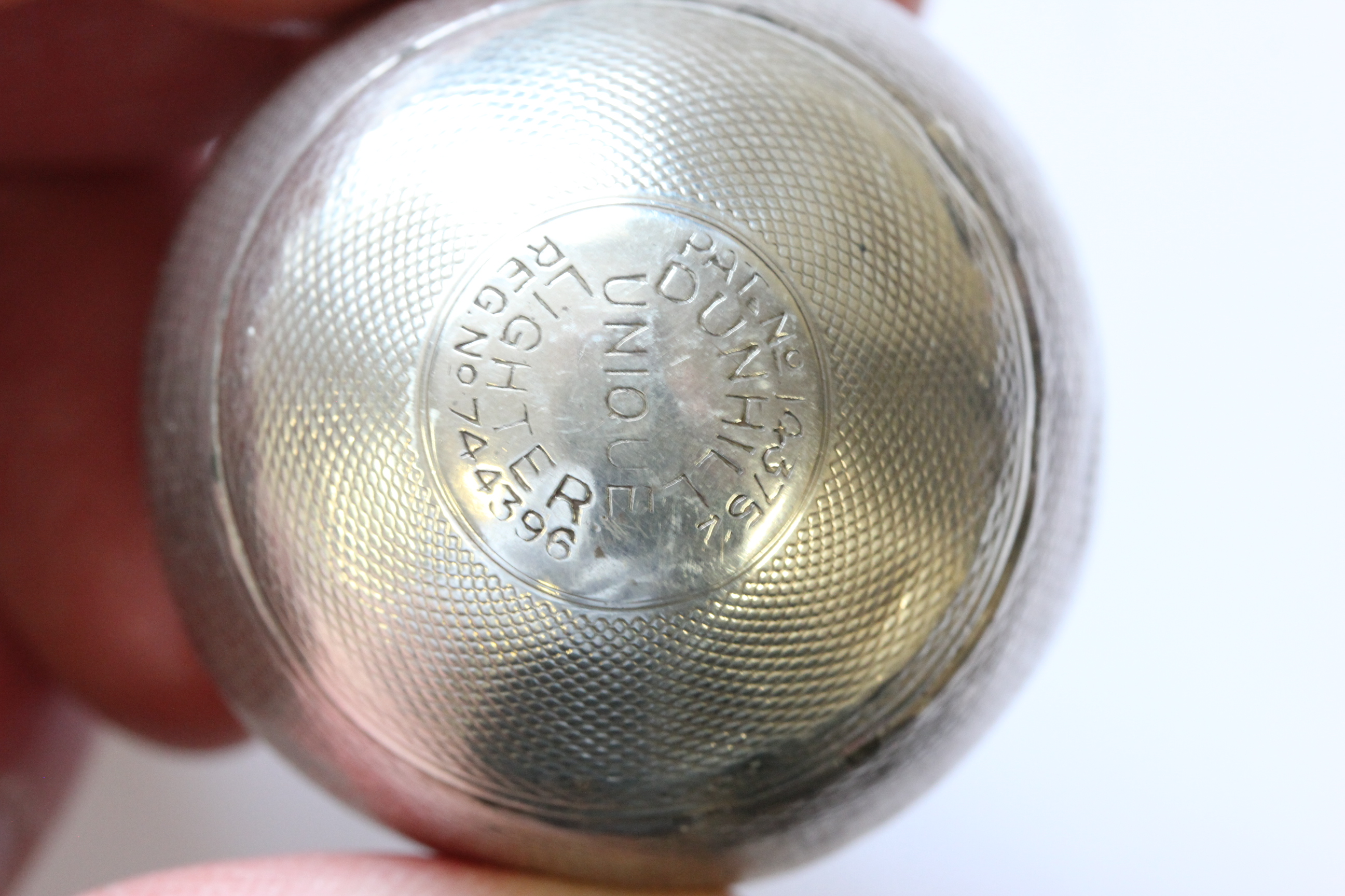 A hallmarked silver Dunhill lighter; of spherical form; with engine turned decoration; the hinged - Image 8 of 14