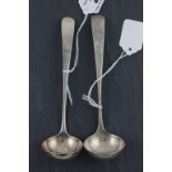 A pair of George III Scottish hallmarked silver sauce ladles; with Old English pattern handles;