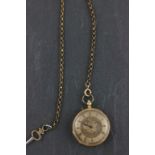 An 18ct yellow gold pocket watch; with brass chain and key