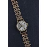 A ladies 9ct yellow gold Tissot wristwatch; complete with papers