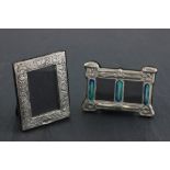 Two silver picture frames one set with enamel