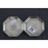 A hallmarked silver pair of octagonal pintrays; H.H. Plante; London 1935