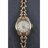 A ladies 9ct gold Accurist wristwatch and gold strap