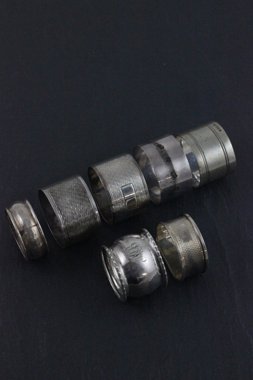 A pair of hallmarked silver napkin rings; with engine turned decoration; H. Brothers; Birmingham