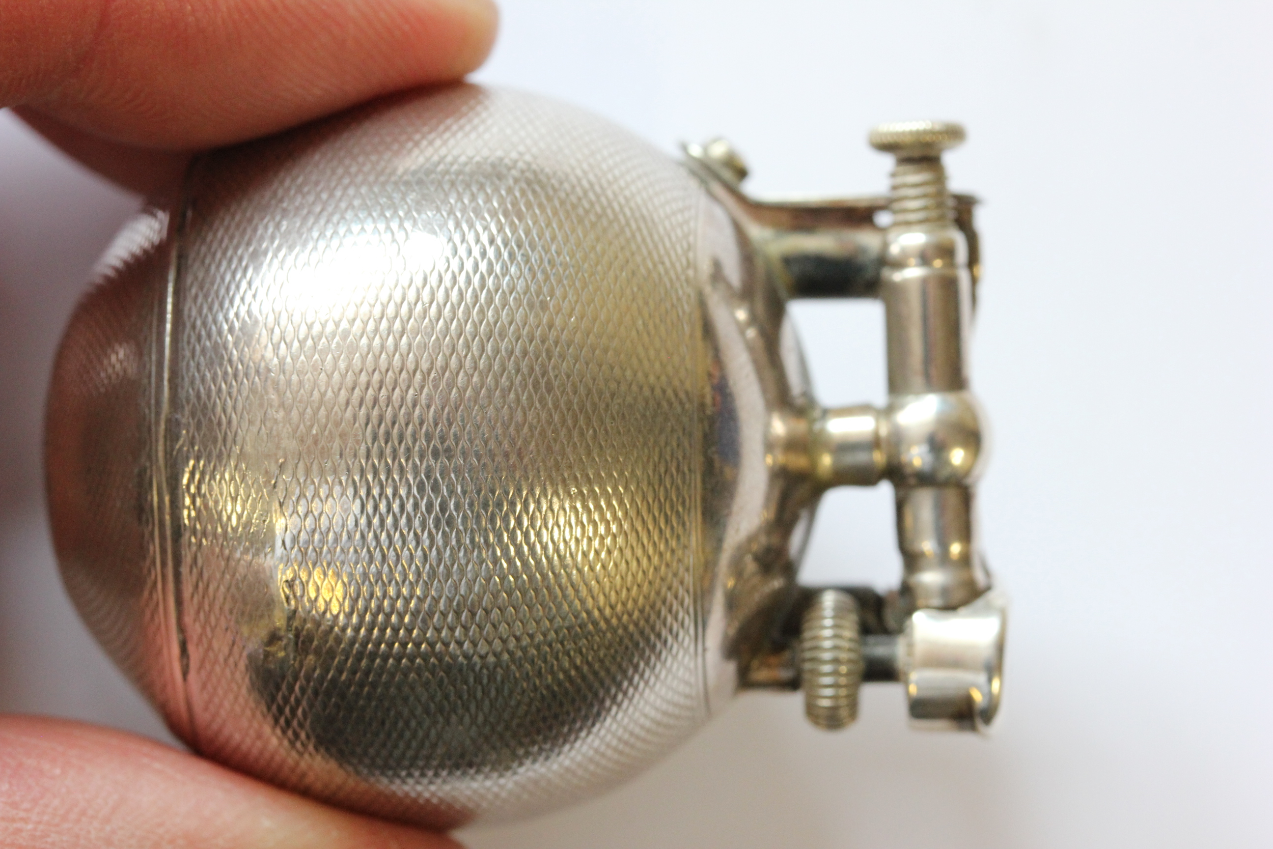 A hallmarked silver Dunhill lighter; of spherical form; with engine turned decoration; the hinged - Image 14 of 14