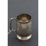 A late Victorian hallmarked silver Christening mug; Hilliard & Thomason; Birmingham 1884; with 'C'