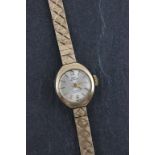 A ladies 9ct yellow gold Technos watch and strap