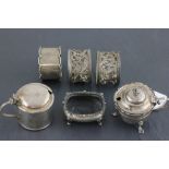 Three hallmarked silver napkin rings; two silver mustards (one with glass liner) and an open