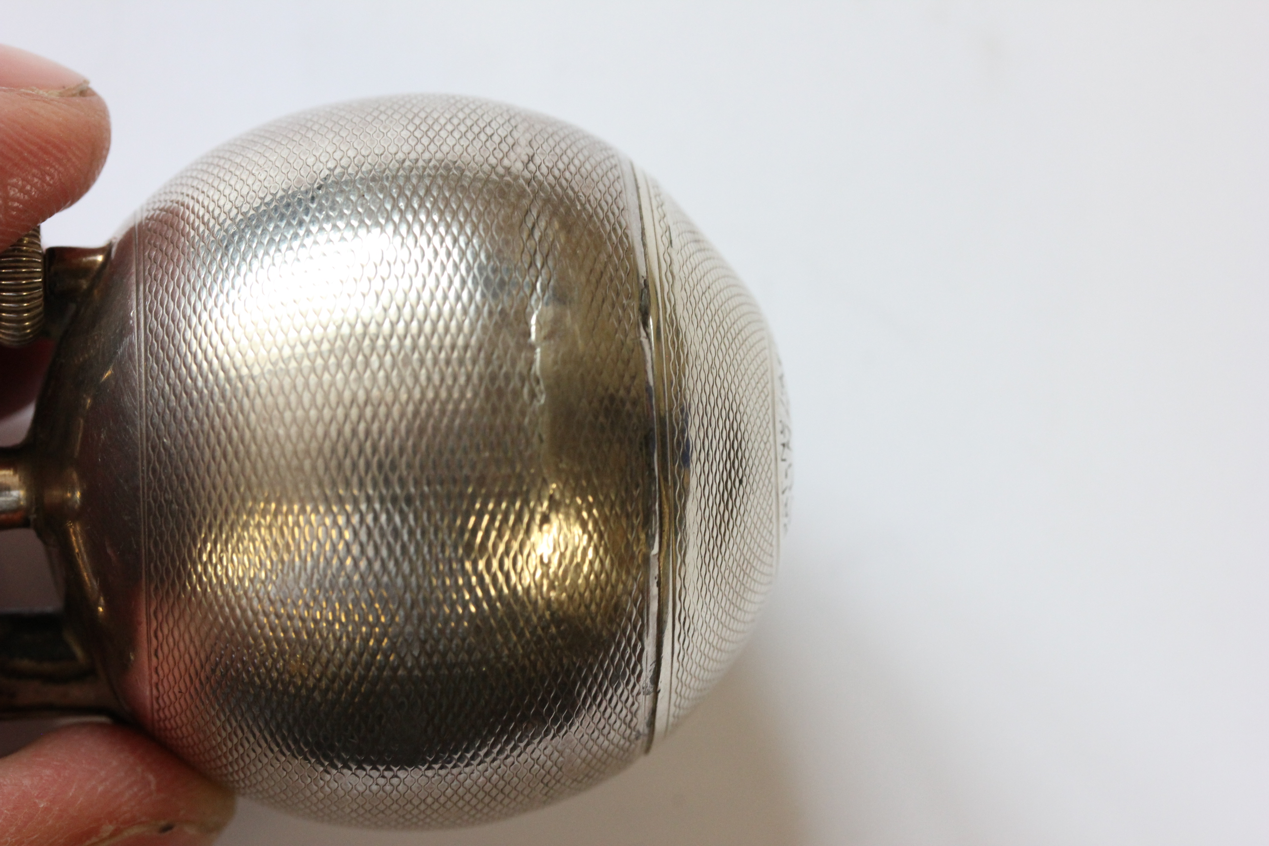 A hallmarked silver Dunhill lighter; of spherical form; with engine turned decoration; the hinged - Image 10 of 14