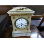 A 19th century alabaster mantle clock; in the Egyptian revival style; the white enamel dial with