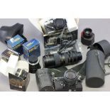 A box of various camera equipment; to include Olympus; lenses etc