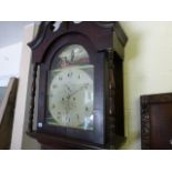 A George III oak long case clock; with broken swan neck pediment; painted dial bearing the name W.