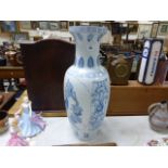 A large blue and white Chinese porcelain floor standing vase; decorated with flowers