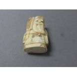 Signed Oxbone netsuke of a man with fan