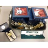 A box of assorted watches and miniature clocks