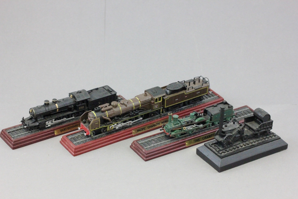 A group of four scale model locomotives to include Stephenson's Rocket