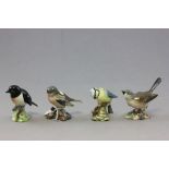 Four Beswick birds; 'Blue Tit', Whitethroat, Chaffinch, & Stone Chat