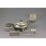 Group of Silver Plate including 2 Toast Racks, Trophy, Teapot and Glass Sugar Bowl with Silver Plate