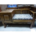 A mid 20th century oak telephone table with seat