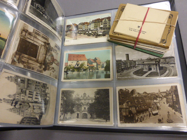An album of early 20th century European and other post cards; together with a quantity of loose