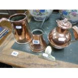 A copper Jersey jug; together with two other pieces of copper and a brass clip