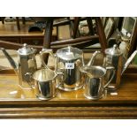 A Harrison Brothers & Howson for Harrods three piece silver plated coffee set together with two