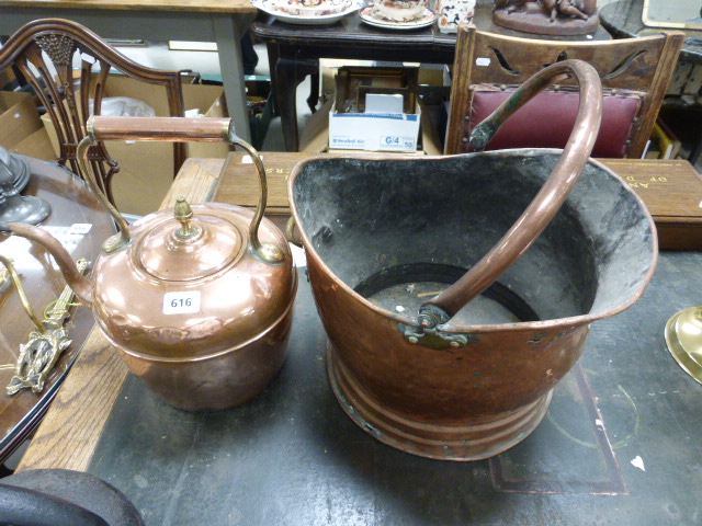 A copper coal scuttle with swing handle; together with copper kettle