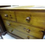 A pine chest of two short over two long drawers