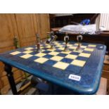 A plastic floor standing chess board, complete with pieces