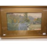 Early 20th century; indistinctly signed; lake scene with dwelling; watercolour