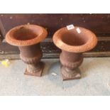Two heavy cast iron urns