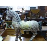 A painted wooden model of a horse