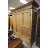 A large 19th century possibly German pine gentleman's wardrobe; of flat pack design