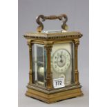 A 19th century French brass repeater carriage clocks; with each corner with Corinthian columns; with