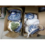 Two boxes of blue and white china; together with a Royal Doulton lady