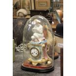 A late 19th century possibly German porcelain mantle clock; surmounted with a seated lady reading