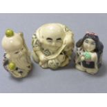 Three netsuke type carvings to include Happy Buddha, God of Longevoty and Lady with gift