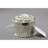 Silver Rouge Pot and Lid with embossed floral and scroll decoration, Birmingham 1902