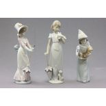 Three boxed Lladro porcelian figures; Sheppess with Rooster; Garden Song and Summer Stroll
