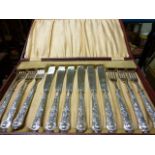 A set of six silver handled fish knives and forks; in original fitted case