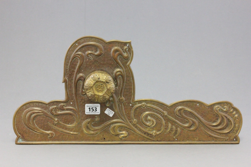 A Victorian large brass art nouveau door handle with back plate