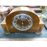 A 1930s walnut cased mantle clock