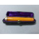 A silver mounted amber cheroot holder; in original fitted box