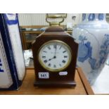 An Edwardian mahogany Harrods & Co inlaid mahogany mantle clock; the white painted dial with black