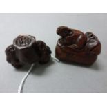 Two wood netsuke carvings to include mice on shoe and three rabbots